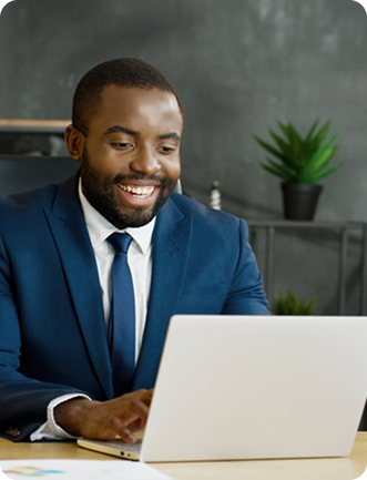 Man in suit working on laptop